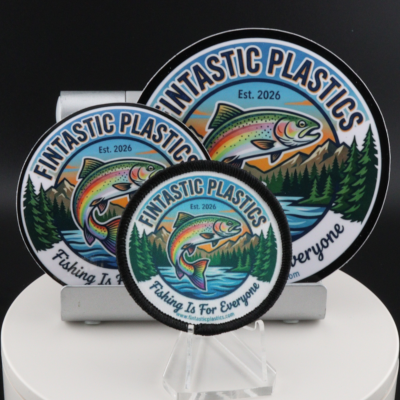 Set of round iron-on patches with Fintastic Plastics logo on display stand