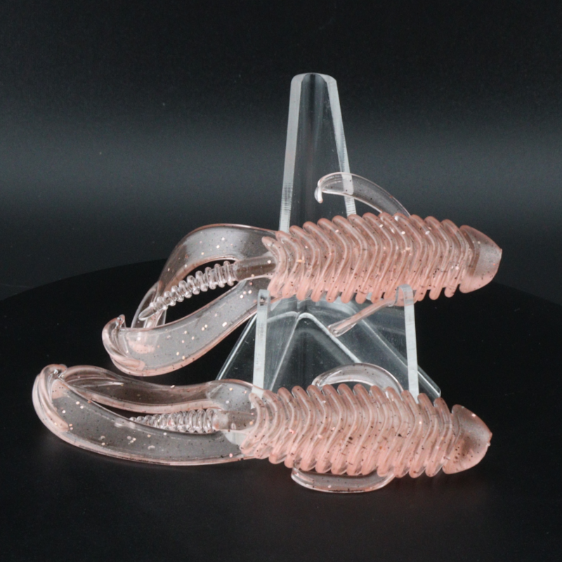 3.25-inch soft plastic swimbait with paddle tails, translucent pink with specks