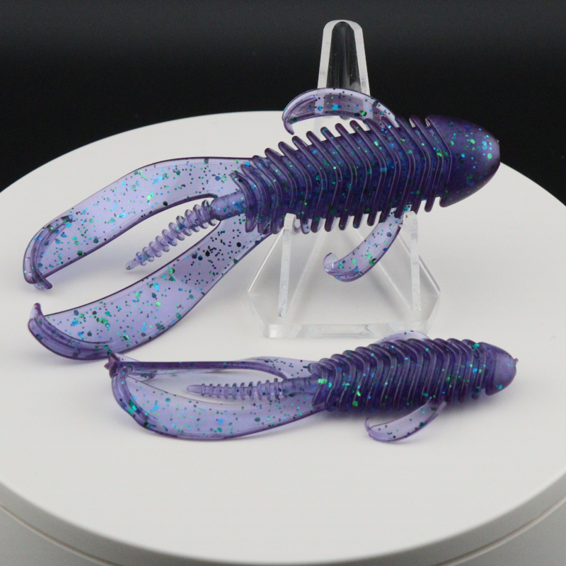 Soft plastic creature baits in deep purple with blue speckles, 3.25–4.25 in