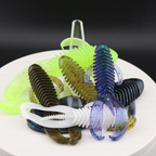 Soft plastic creature baits in neon chartreuse with dark blue accents, 3.25–4.25 in