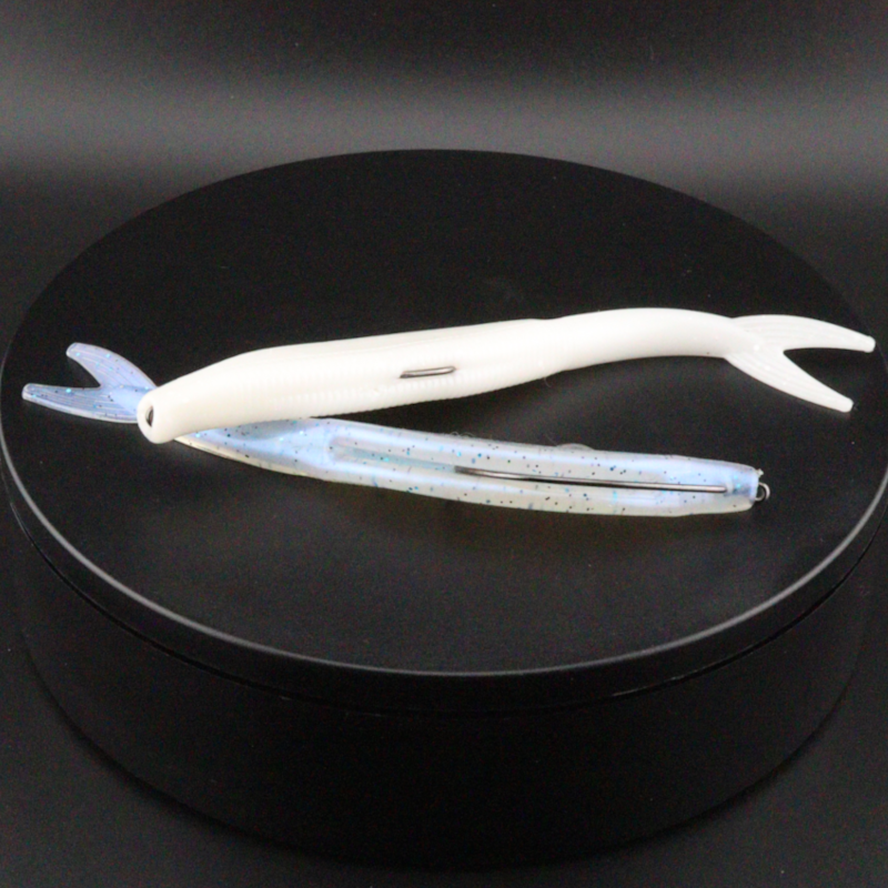 5-inch white fluke lure with blue speckled underside and curved tail