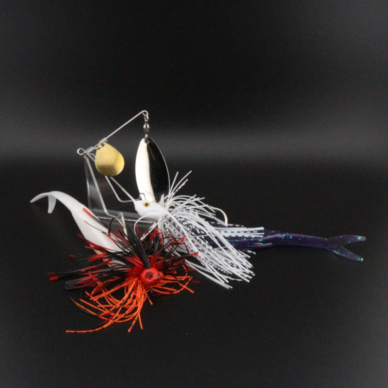 5-inch soft plastic fluke lure with spinner blades, white skirt, red and black accents