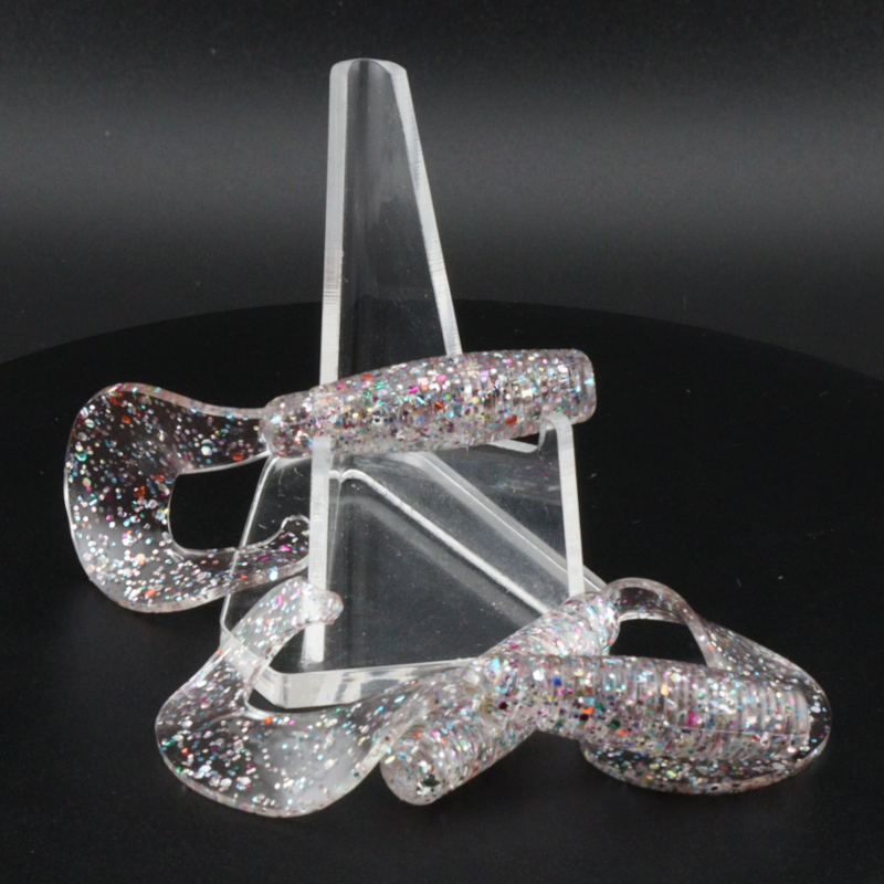 Glitter bomb fishing bait set with clear stand and silver multicolor lure pieces