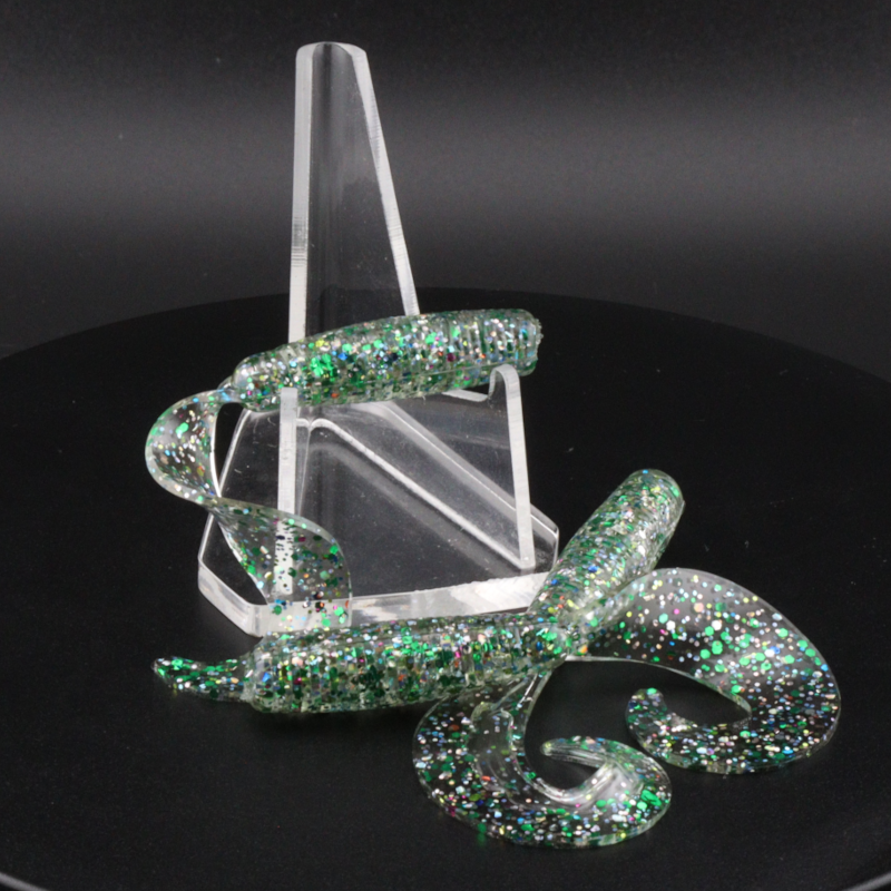 Glitter bomb fishing bait set with clear stand and green glitter snake-like lure