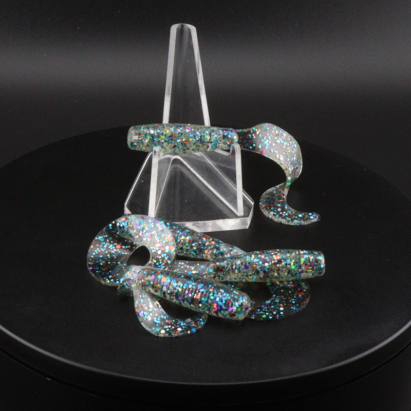 Iridescent glitter grub baits with clear plastic display, curled worm shapes