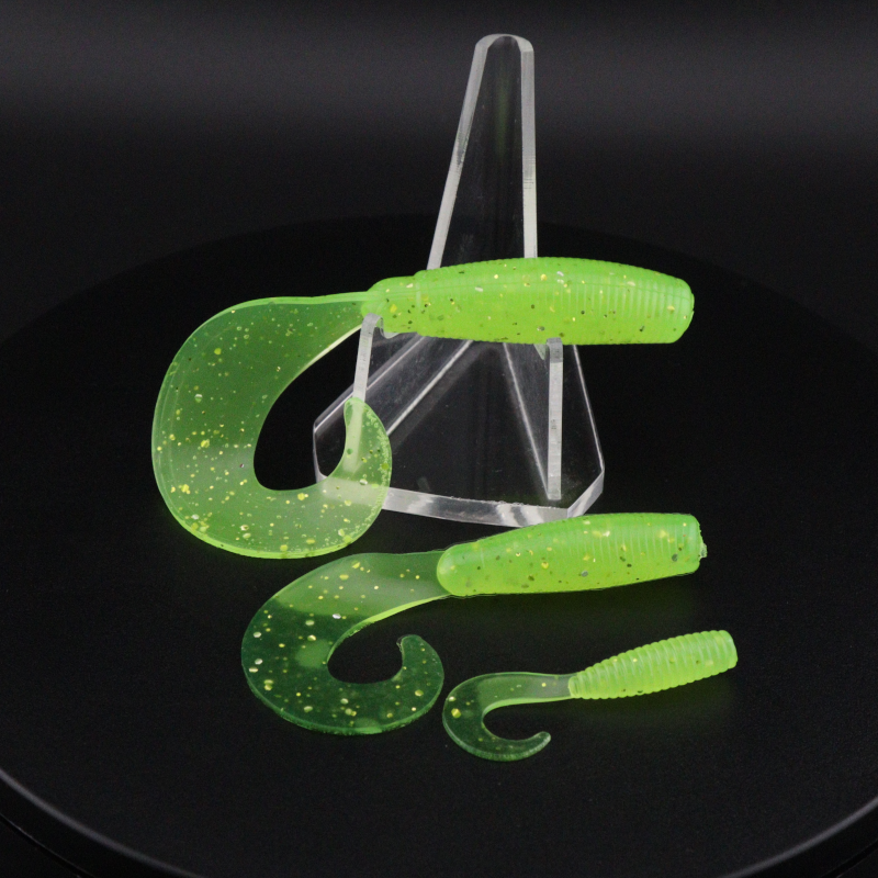 Go-to Grub soft fishing lures in bright green speckled color, worm-shaped with curly tails