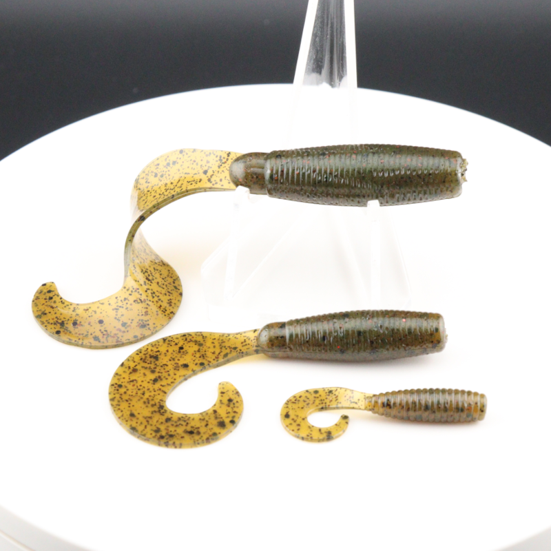 Go-to Grub soft fishing lures in yellow-brown speckled color, worm-shaped with curly tails