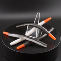 Fishing lure set: white and black striped worms with orange accents, arranged on stand