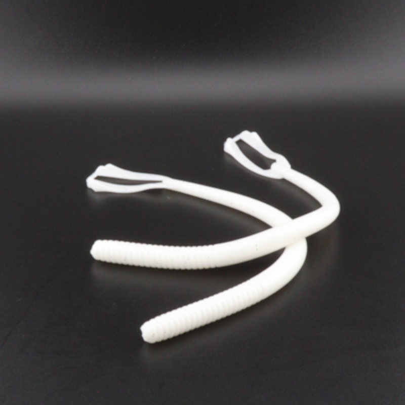 Soft plastic worm lures, white with ribbed texture and curled bodies