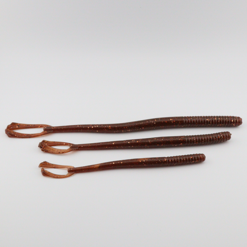 Red-brown glitter fishing worm lures with curled tails