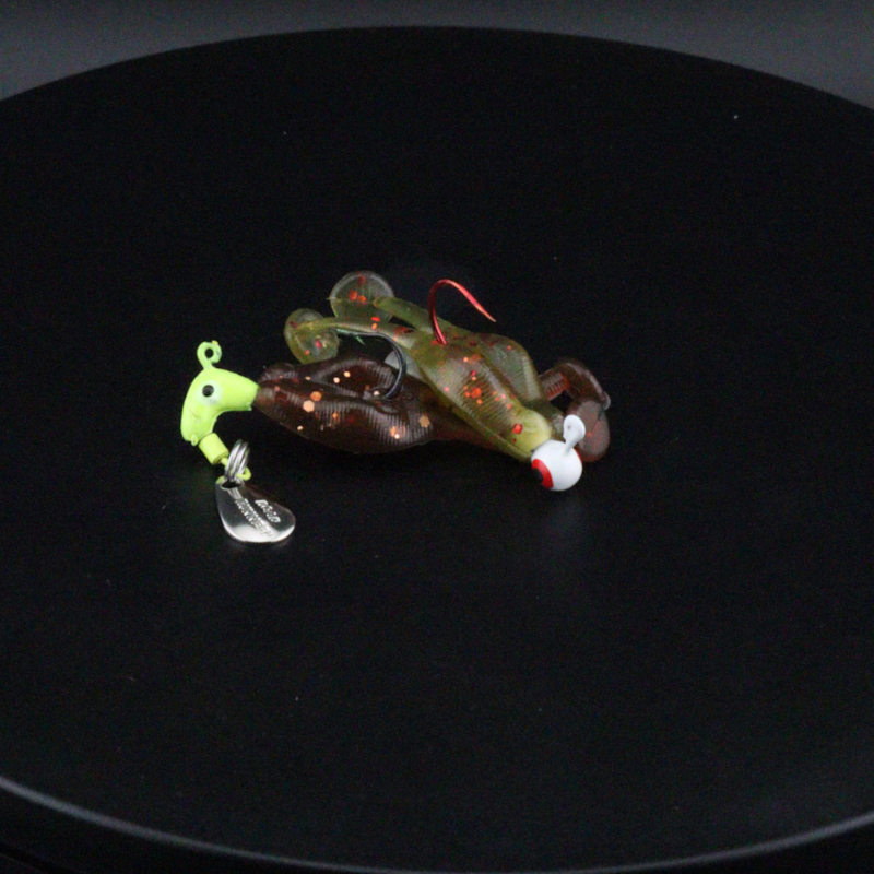 Small frog-shaped fishing lures with clear spinner blades and red accents