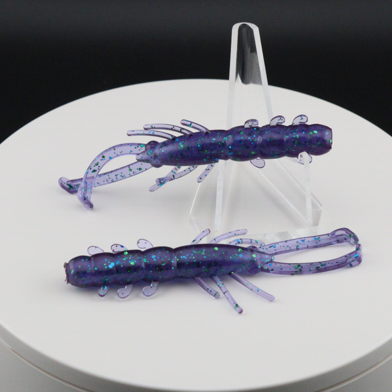 Buggy Shrimp lure, deep purple-blue speckled body with teal shimmer and curled appendages