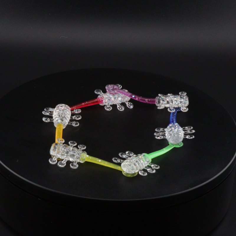 PRIDE UFO 2-inch glass circle ornament with rainbow-colored tubes and crystal beads