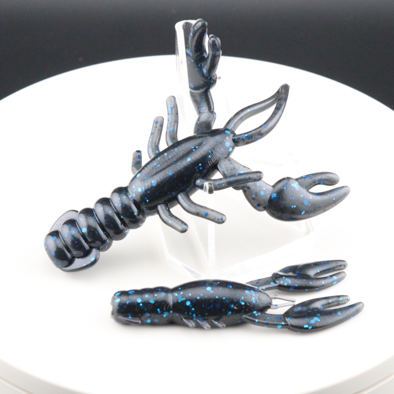 Blue and black speckled soft plastic craw bait with curled claws