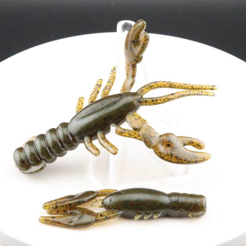 Greenish and tan speckled soft plastic craw bait with spread claws