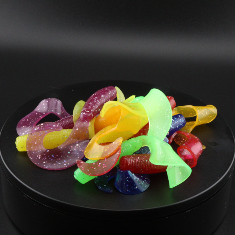 4-inch soft plastic grub lure with multicolor Pride swirls