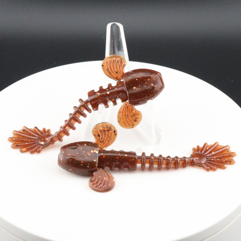 3.5-inch goby-style soft plastic lure, speckled reddish-brown with orange fins and tail