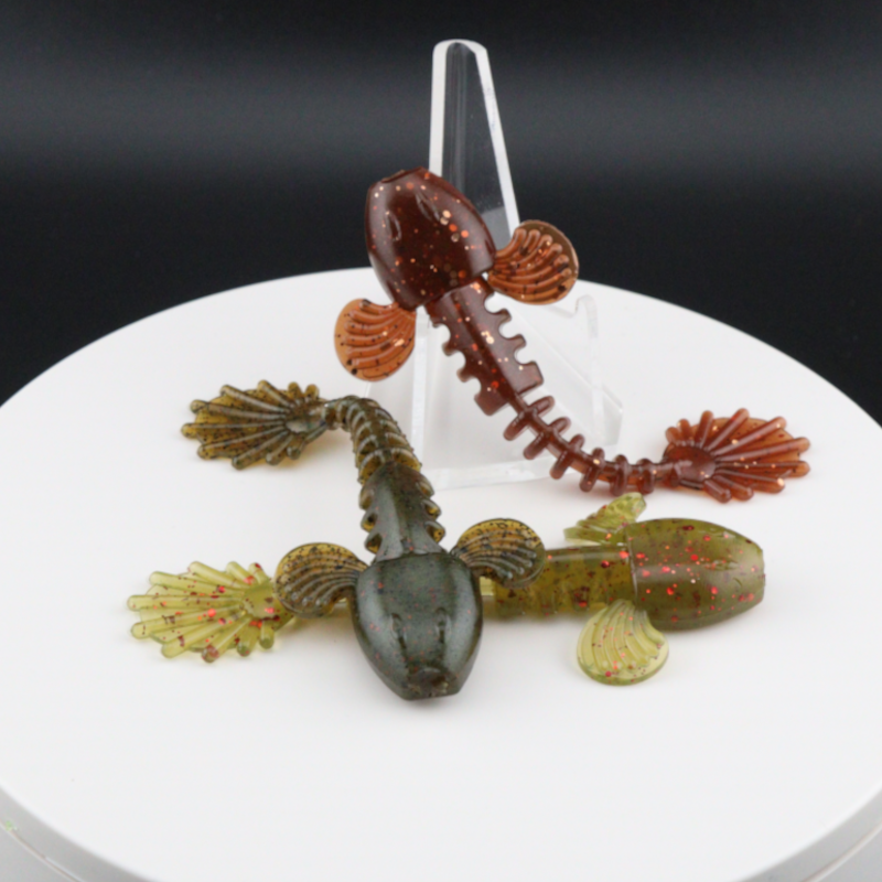 3.5-inch goby-style soft plastic lure, speckled dark brown with orange fins and tail