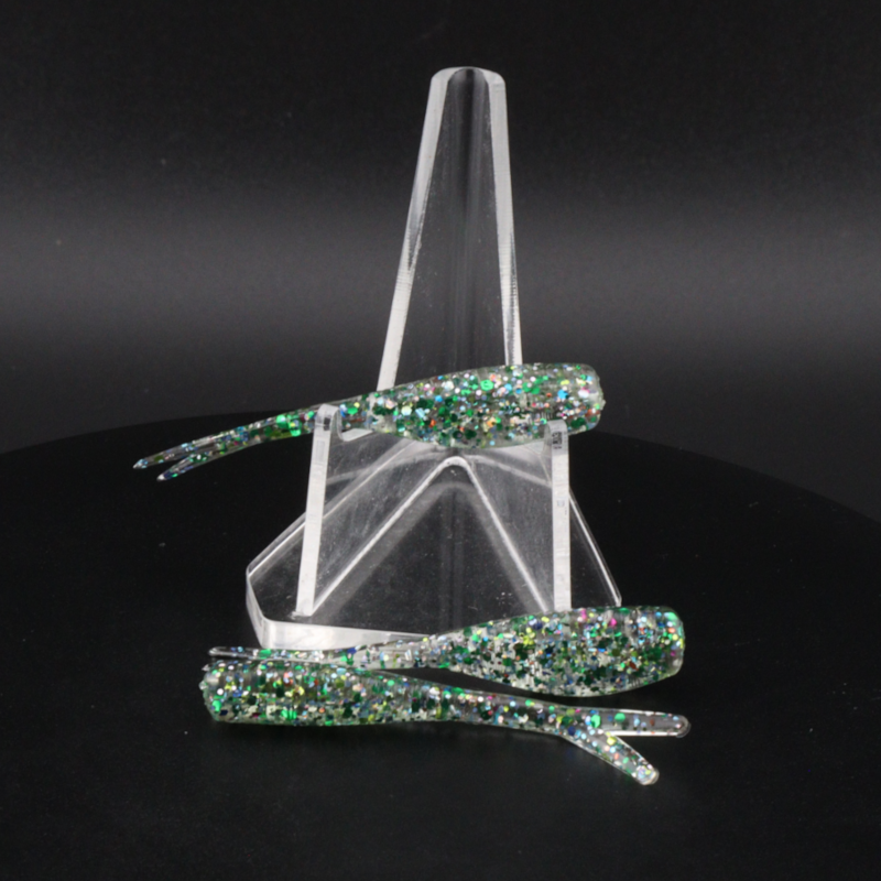 Glitter fishing bait with green sparkly soft lures on a clear pronged holder