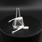 2-inch white soft plastic fishing lure with tail fins in clear holder