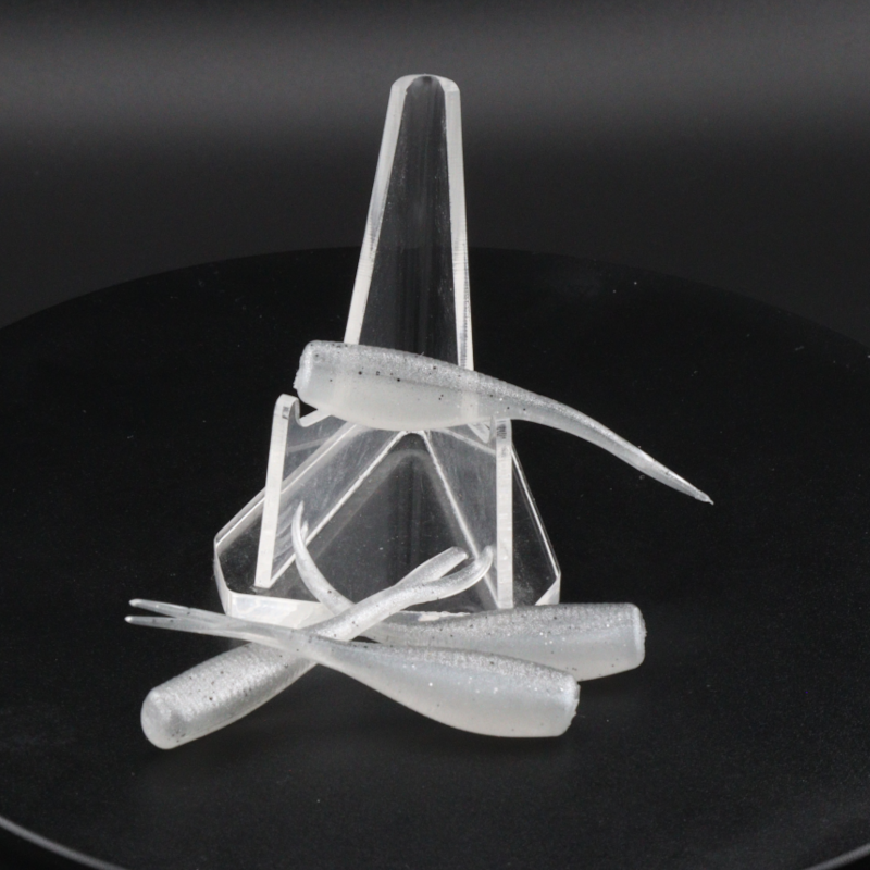 2-inch silver-gray soft plastic fishing lure with tail fins in clear holder