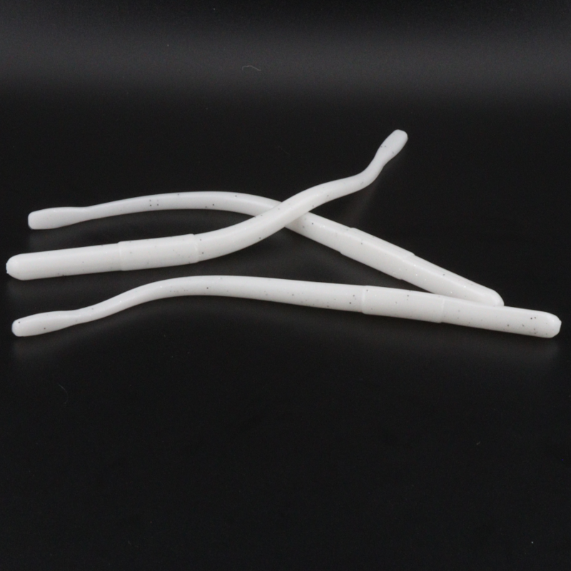 Straight tail worm lures in white with subtle specks, four curved bodies