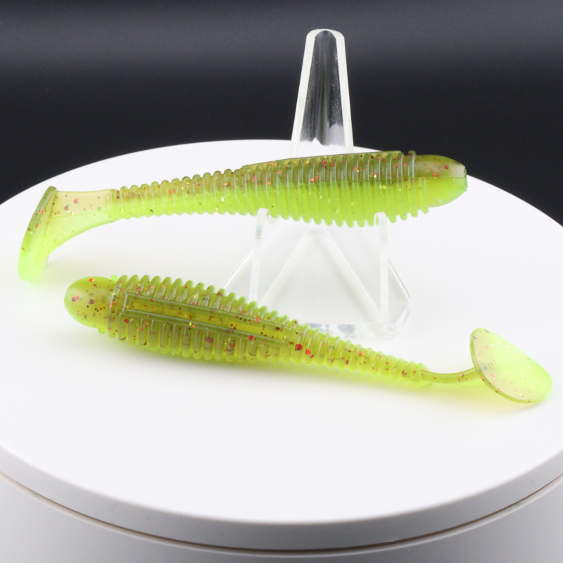 3.2-inch ringer soft plastic fishing lure, neon green with red speckles, paddle tails