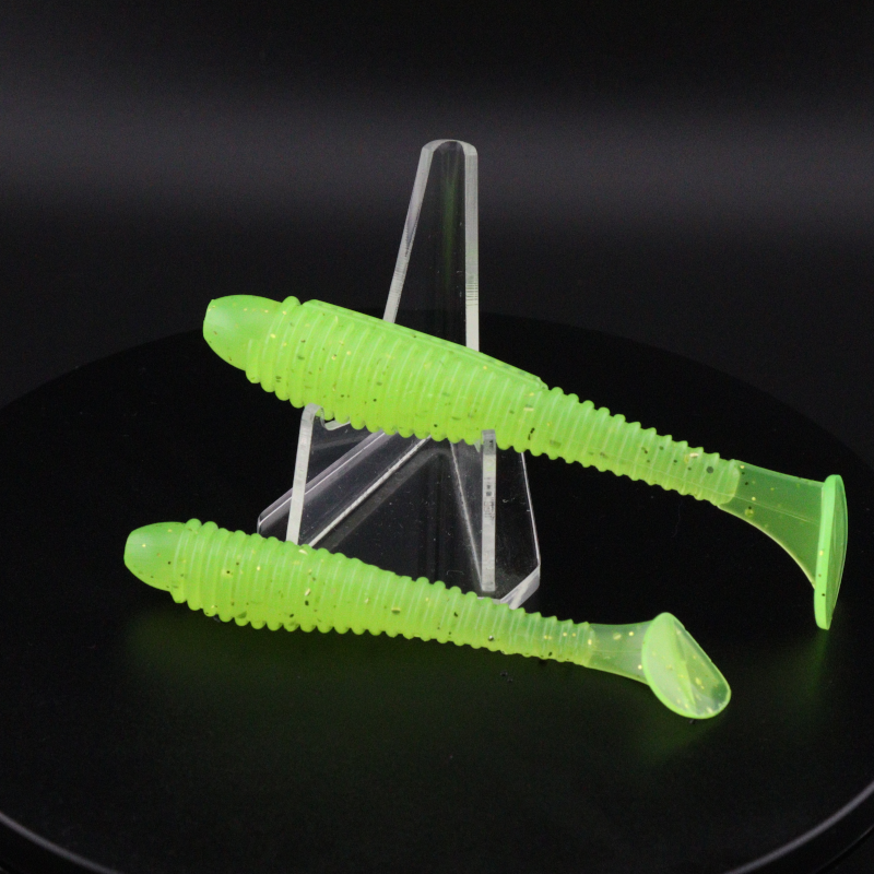 Neon green soft plastic ringer fishing lures with ribbed body and curled tail