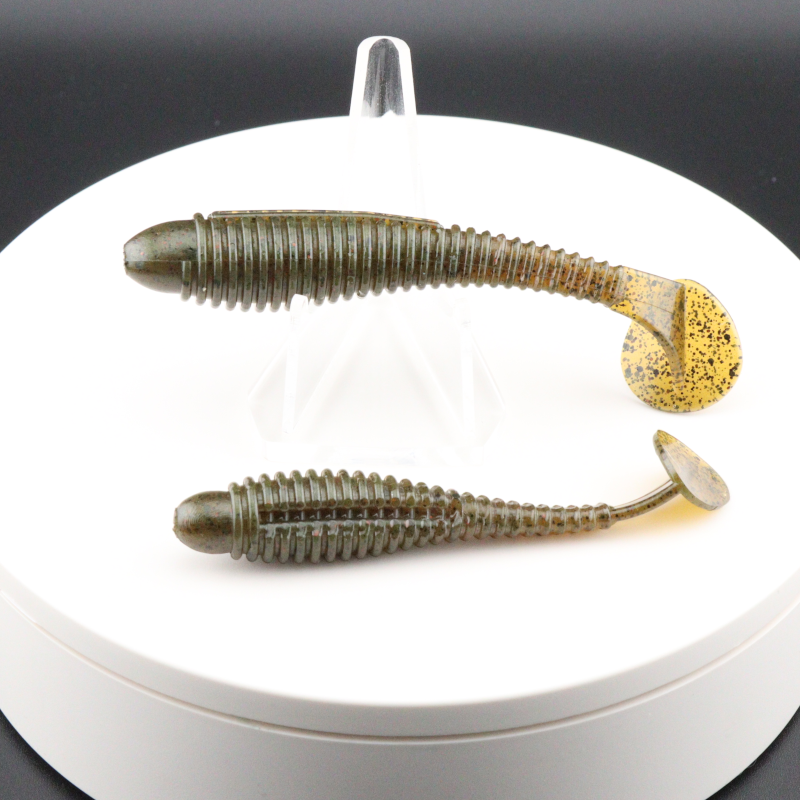 Olive gold speckled soft plastic ringer fishing lures with ribbed body and curled tail