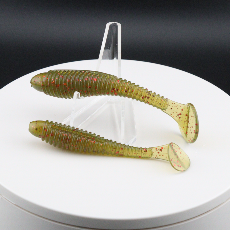 Olive green red-speckled soft plastic ringer fishing lures with ribbed body and curled tail