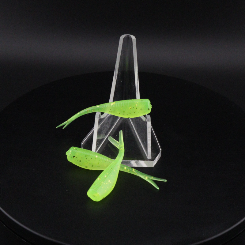 Neon green 2-inch soft fishing lures with paddle tails in clear plastic holder