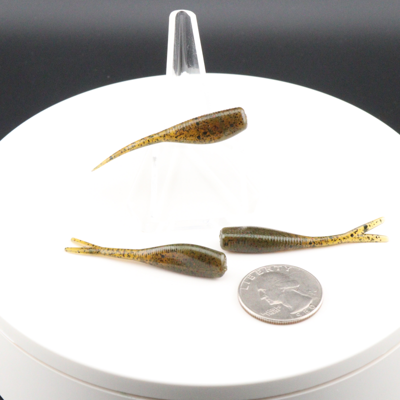 Brown gold speckled 2-inch soft fishing lures with paddle tails in clear holder