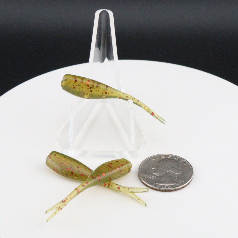 Yellow-green speckled 2-inch soft fishing lures with paddle tails in clear holder
