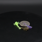 UFO 1.1-inch soft plastic fishing lure, neon green and purple worm baits