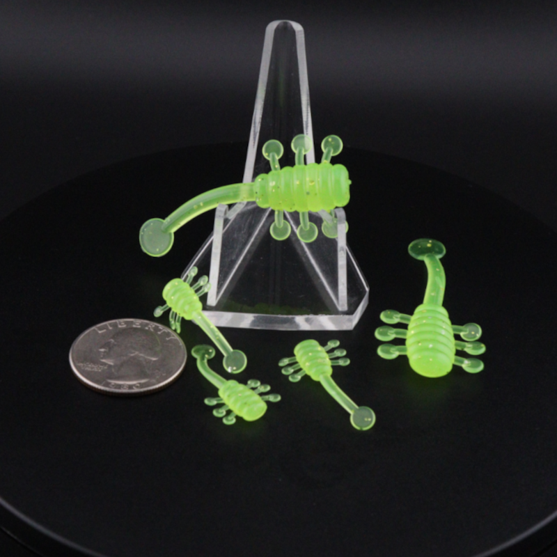 UFO soft plastic fishing lure set in neon green, multiple baits with curled legs