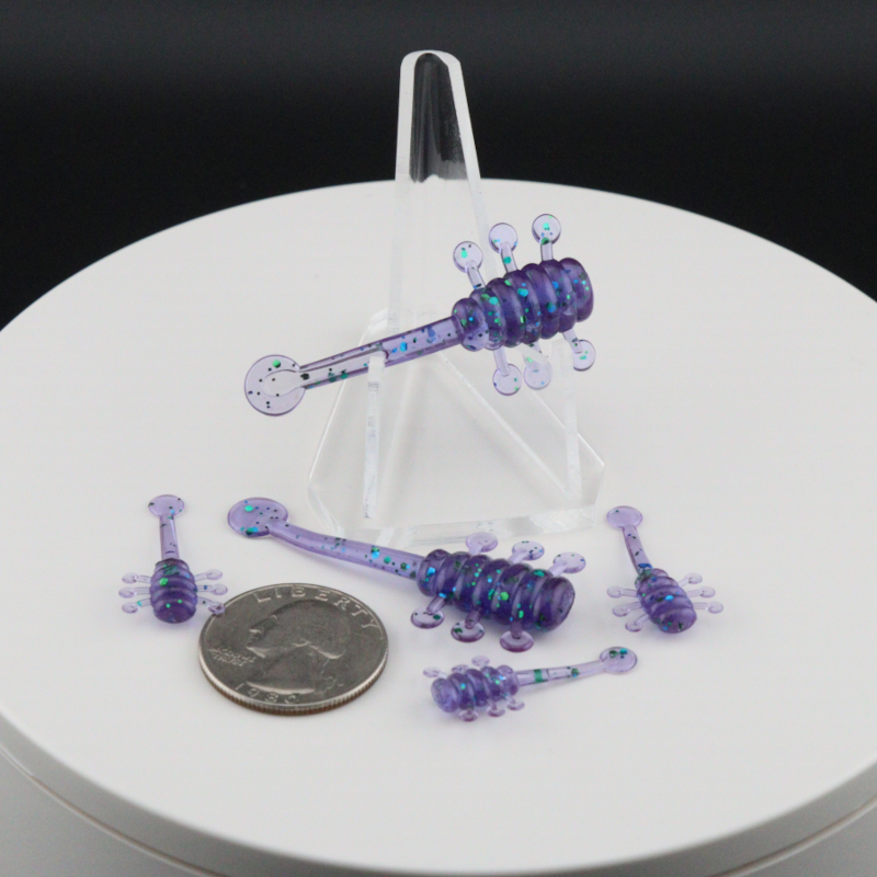 UFO soft plastic fishing lure set in purple, multiple baits with curled legs