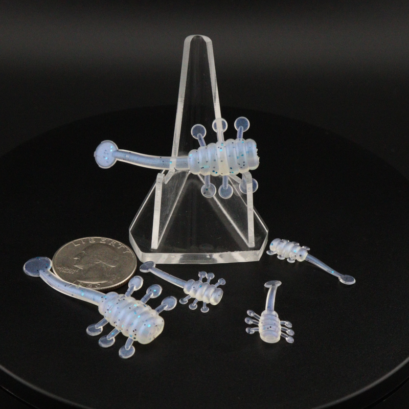 UFO soft plastic fishing lure set in light blue-clear, multiple baits with curled legs